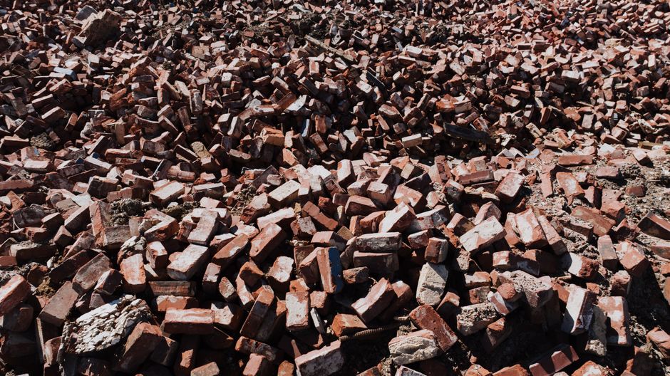 Close-up of mixed brick rubble from demolition, ready for disposal