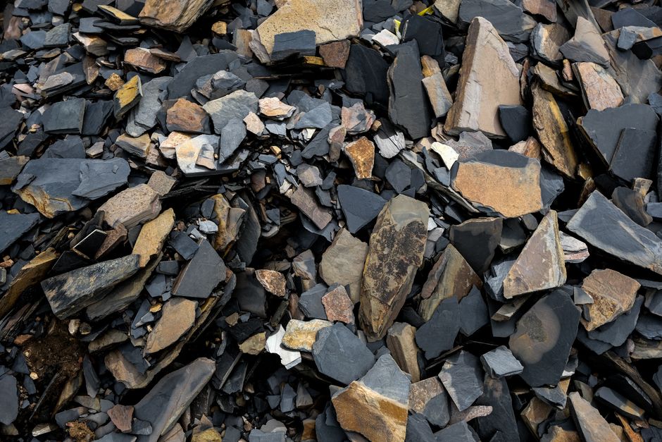 A pile of broken stone and rubble fragments, loose material suited to grab hire