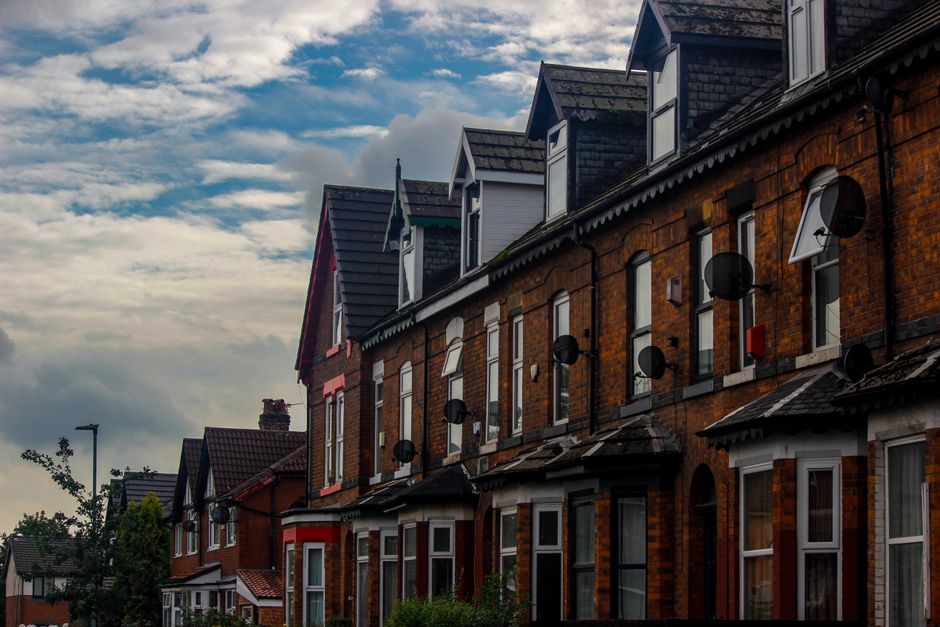 A row of UK terraced houses on a residential street