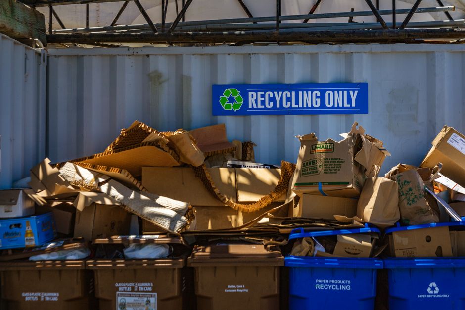 Cardboard and recyclable materials sorted separately from general skip waste at a recycling point